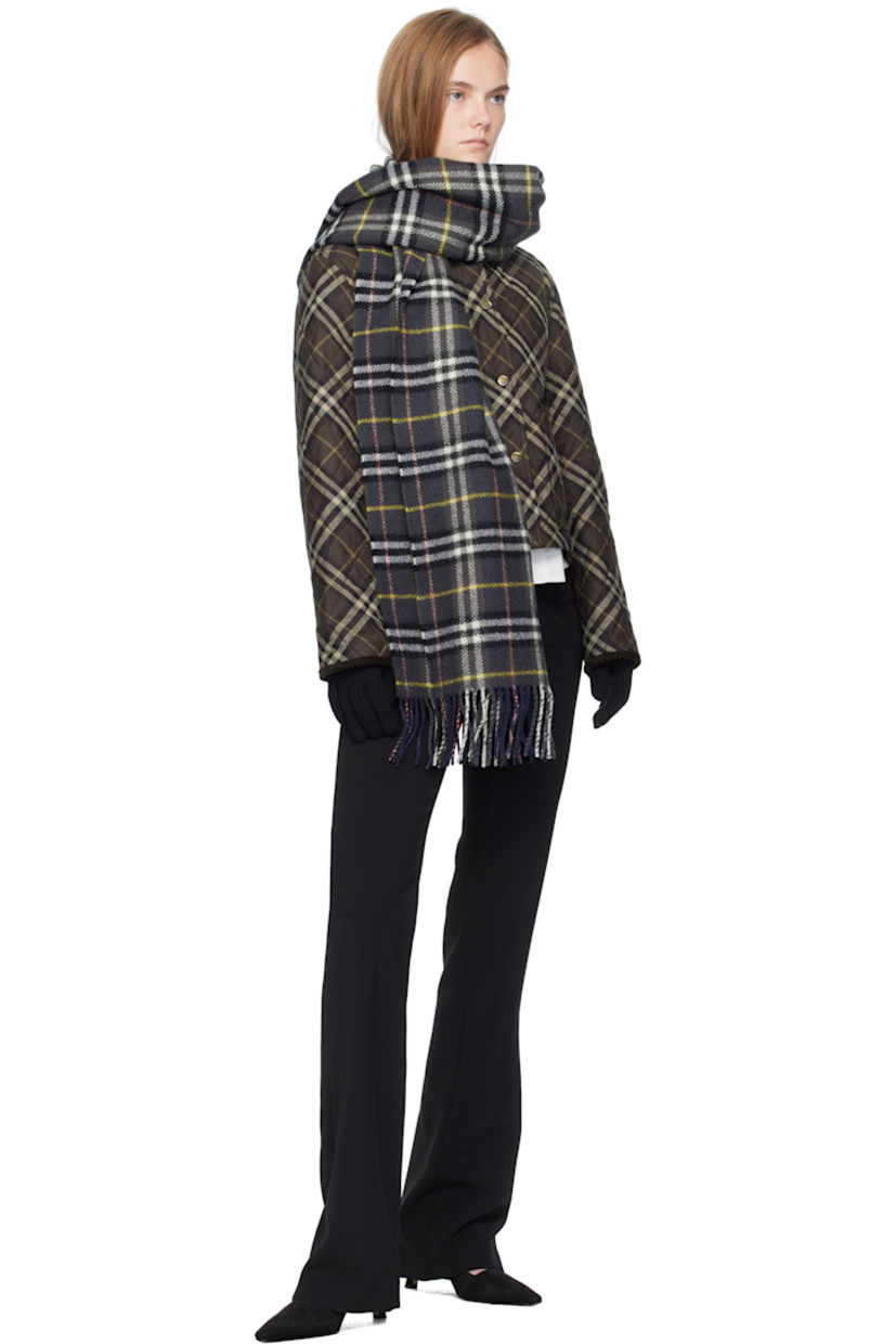 Pair of knit wool-blend gloves. 

· Bouclé logo patch at top
· Rib-knit cuffs

Supplier color: Black