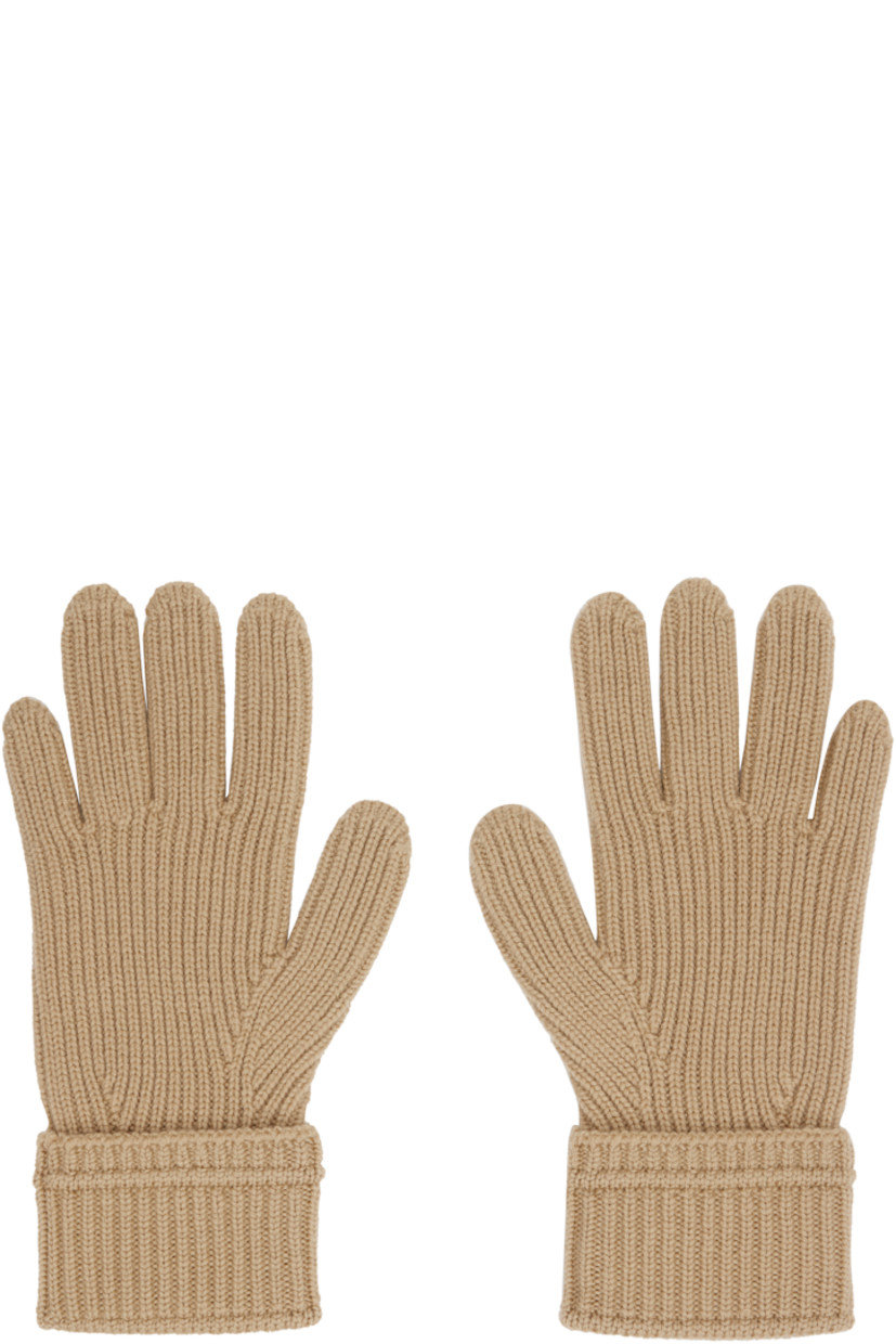 Pair of knit wool-blend gloves. 

· Bouclé logo patch at top
· Rib-knit cuffs

Supplier color: Sand