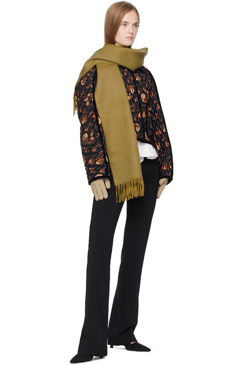 Pair of knit wool-blend gloves. 

· Bouclé logo patch at top
· Rib-knit cuffs

Supplier color: Sand