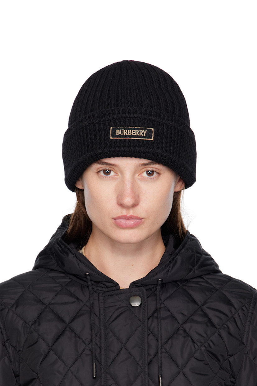Rib-knit wool beanie. Bouclé logo patch at rolled brim.

Supplier color: Black