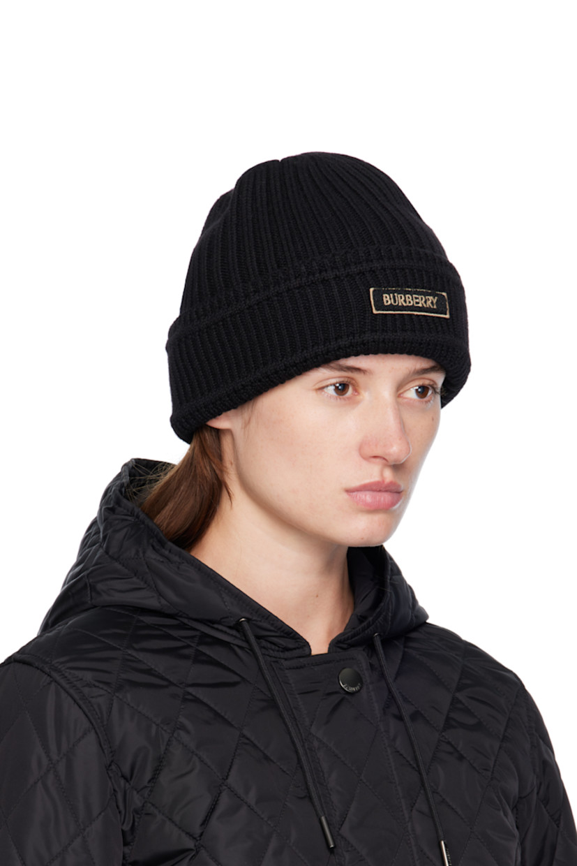 Rib-knit wool beanie. Bouclé logo patch at rolled brim.

Supplier color: Black