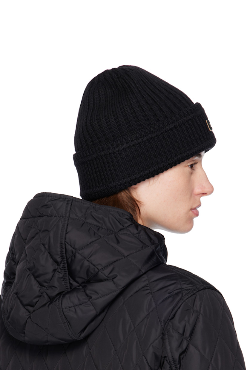 Rib-knit wool beanie. Bouclé logo patch at rolled brim.

Supplier color: Black
