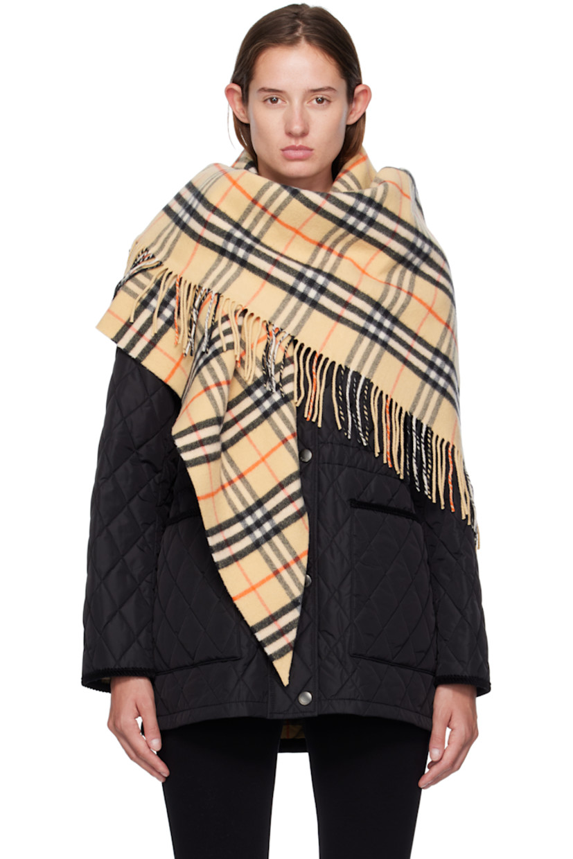 Wool-blend flannel cape.

· Check pattern throughout
· Fringed detailing at end
· L76" x W38"

Supplier color: Sand