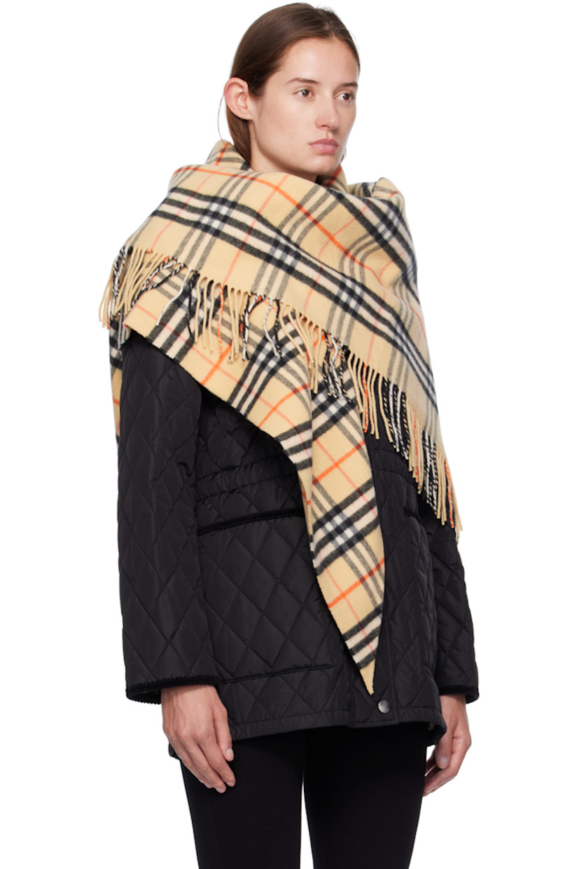 Wool-blend flannel cape.

· Check pattern throughout
· Fringed detailing at end
· L76" x W38"

Supplier color: Sand