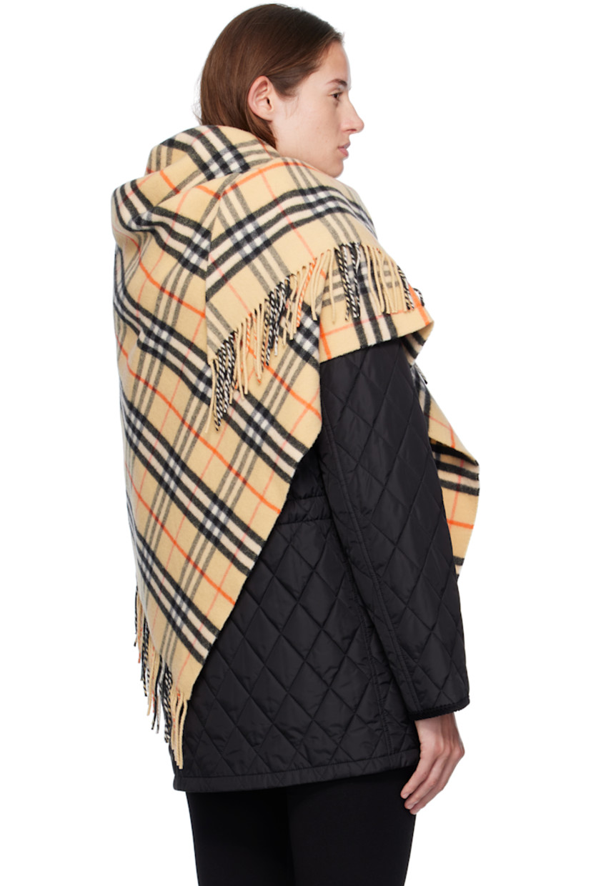 Wool-blend flannel cape.

· Check pattern throughout
· Fringed detailing at end
· L76" x W38"

Supplier color: Sand