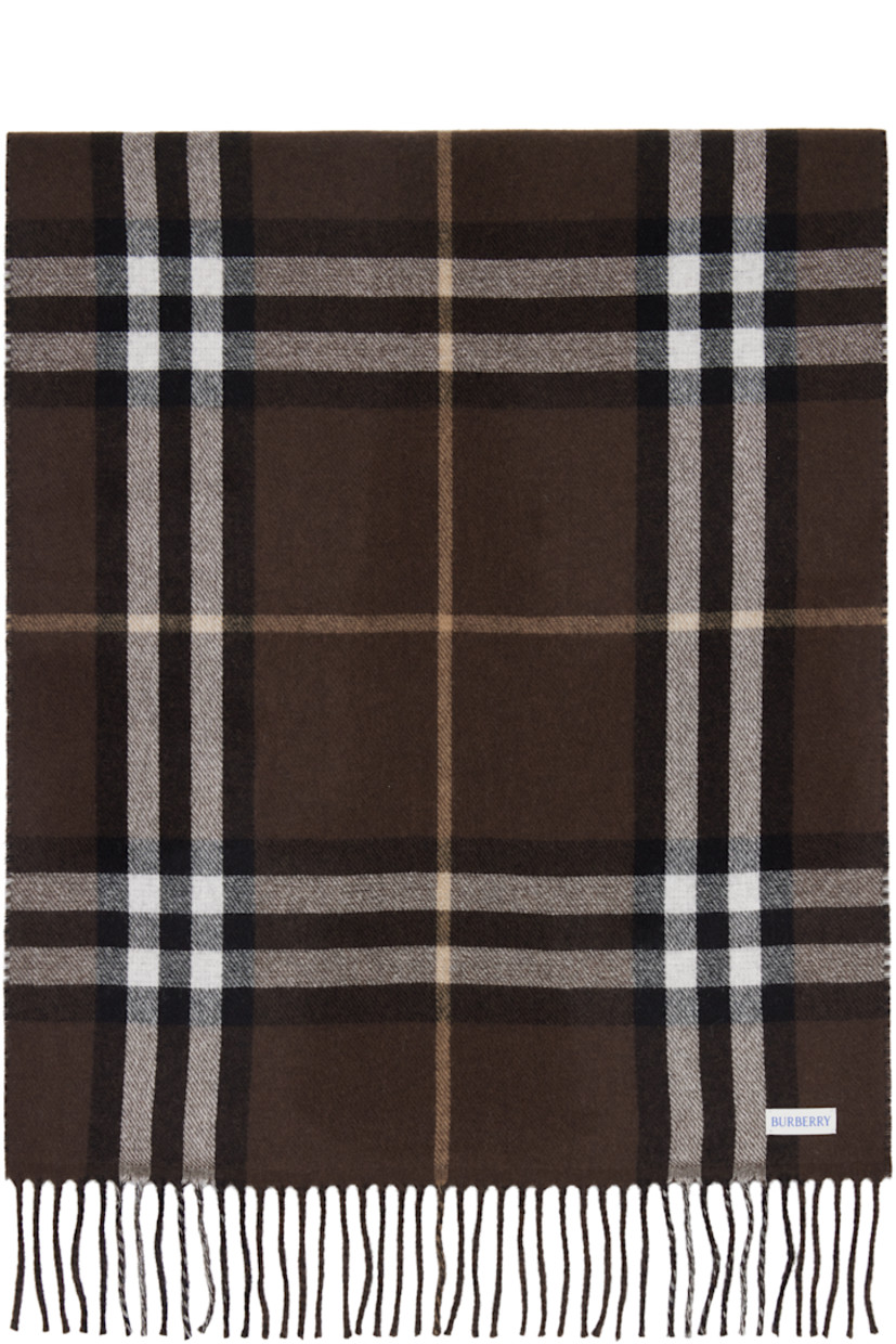 Rectangular cashmere flannel scarf.

· Jacquard logo graphic at face
· Fringed detailing at ends
· Check pattern at back face
· L82.5" x W19.5"

Supplier color: Treacle