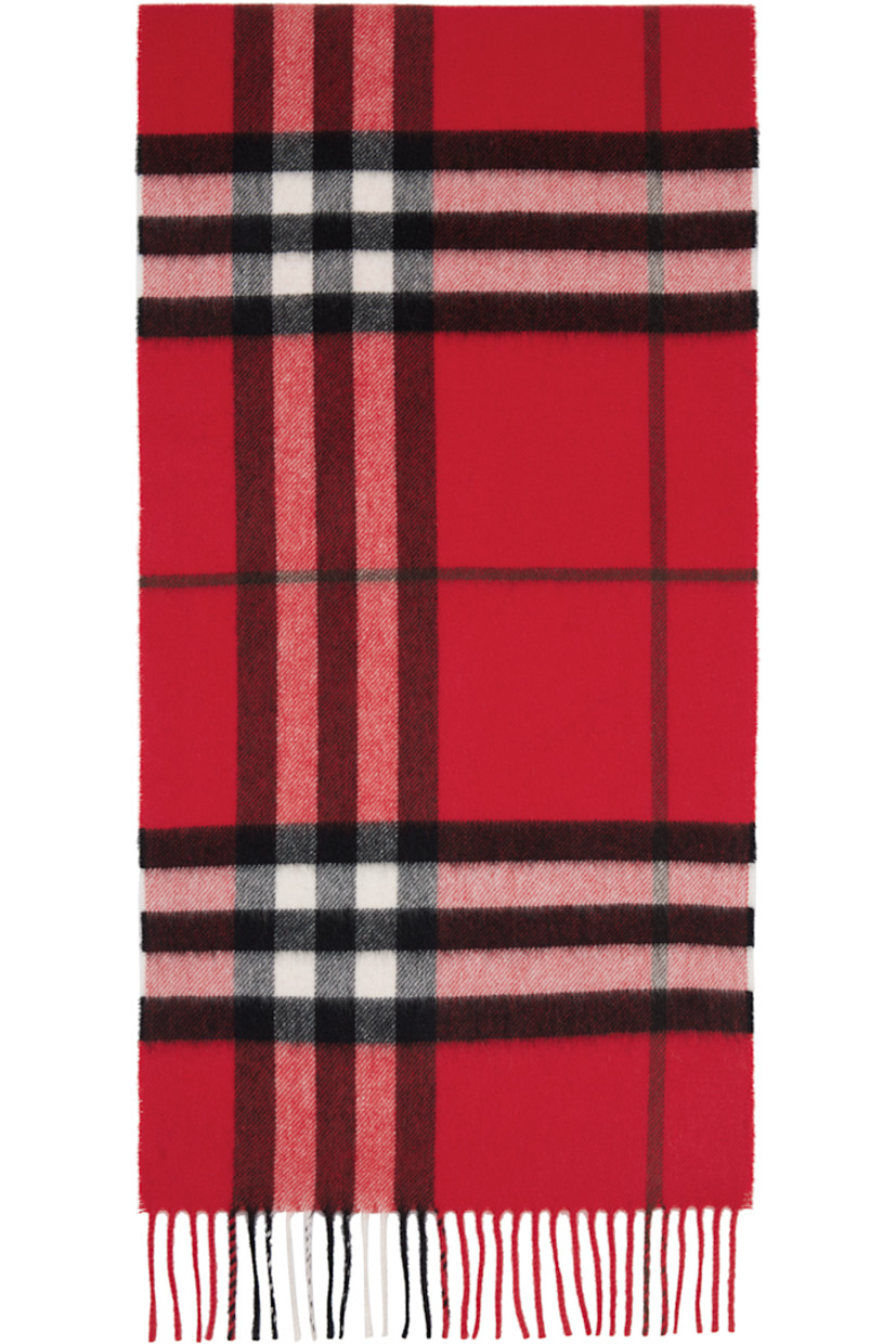 Rectangular cashmere flannel scarf.

· Check pattern throughout
· Fringed detailing at ends
· L66" x W11.75"

Supplier color: Post
