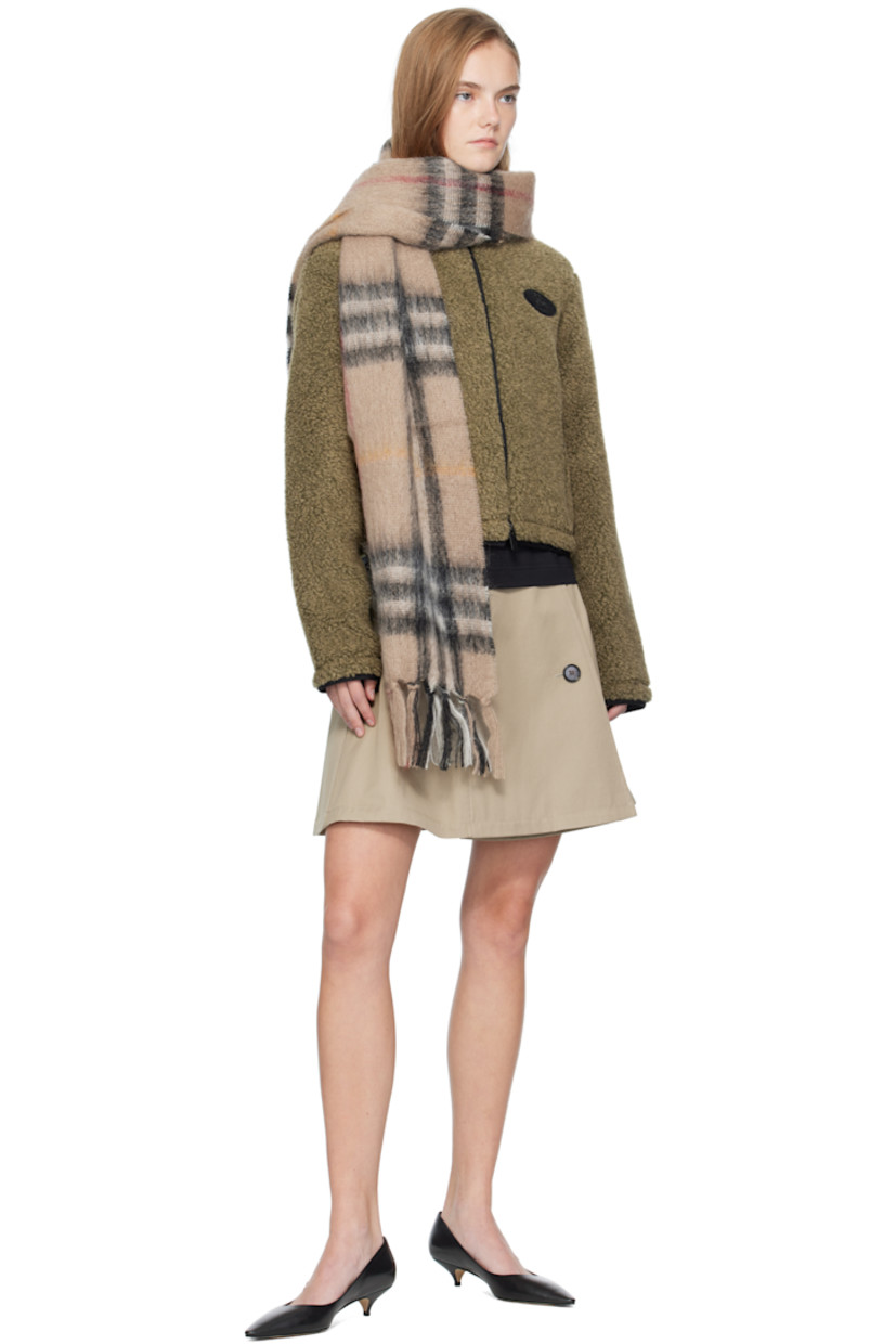 Rectangular brushed mohair- and wool-blend flannel scarf.

· Check pattern throughout
· Fringed detailing at ends
· L66" x W11.75"

Supplier color: Sand