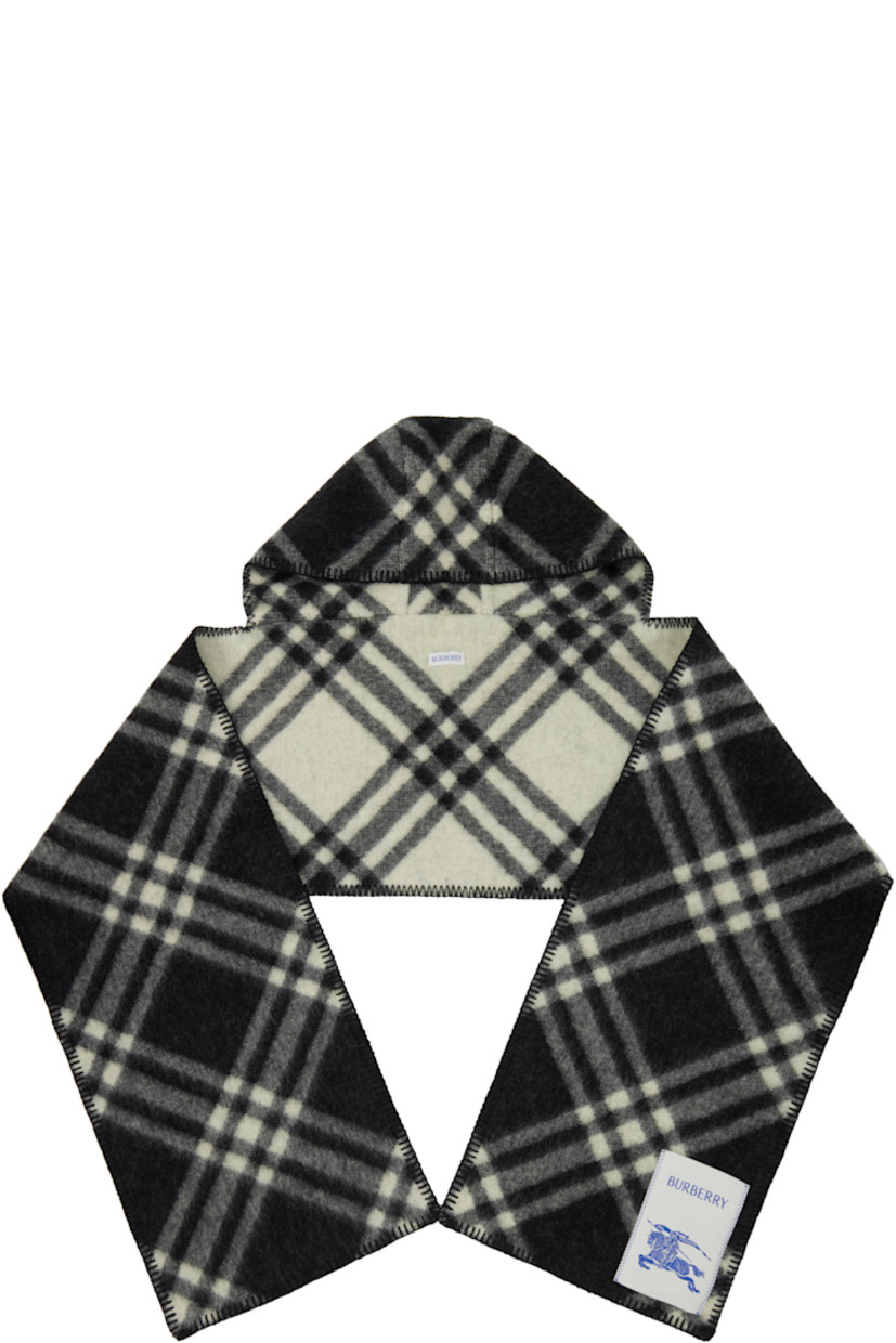 Rectangular wool flannel scarf.

· Check pattern throughout
· Blanket stitching at edges
· Hood at length
· Logo patch at face
· L76.5" x W11.75"

Supplier color: Black