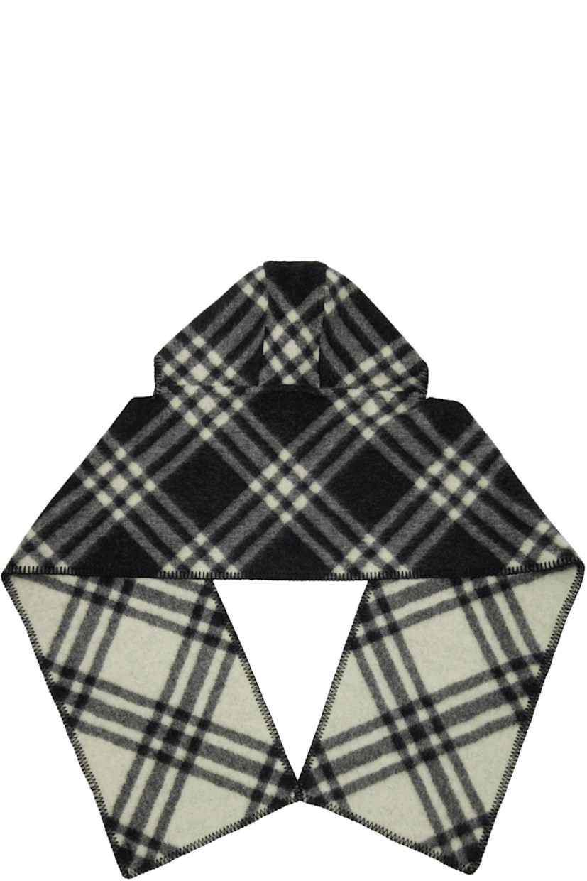 Rectangular wool flannel scarf.

· Check pattern throughout
· Blanket stitching at edges
· Hood at length
· Logo patch at face
· L76.5" x W11.75"

Supplier color: Black