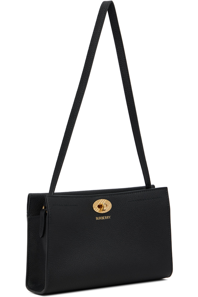 Grained calfskin shoulder bag.

· Fixed shoulder strap
· Logo stamp at face
· Turn-lock closure
· Check-patterned lining
· H6" x W9" x D2.5"

Supplier color: Black