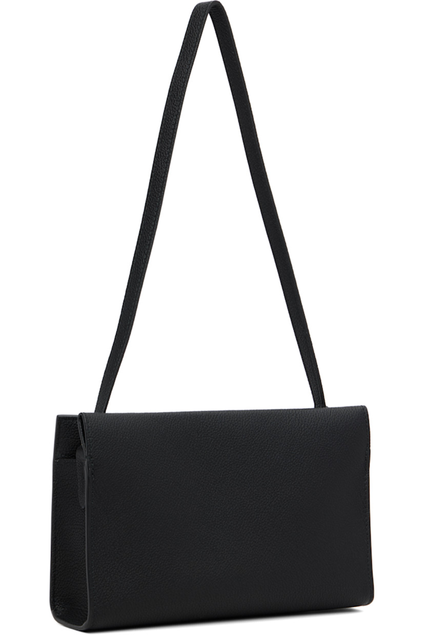 Grained calfskin shoulder bag.

· Fixed shoulder strap
· Logo stamp at face
· Turn-lock closure
· Check-patterned lining
· H6" x W9" x D2.5"

Supplier color: Black