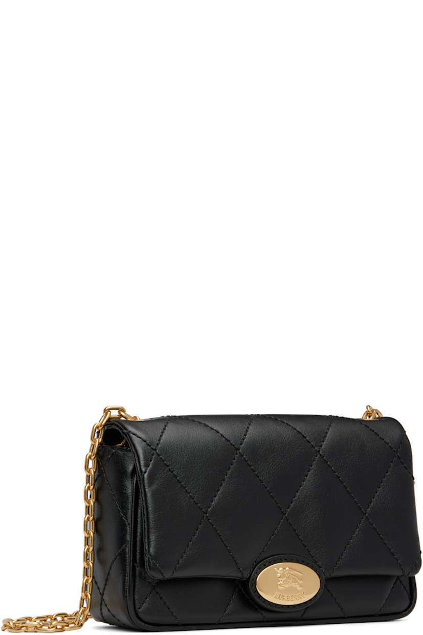 Quilted grained calfskin shoulder bag.

· Cable chain crossbody strap
· Flap with logo-embossed magnetic closure
· Four card slots at interior
· Twill lining
· H5" x W7.5" x D2.75"

Supplier color: Black