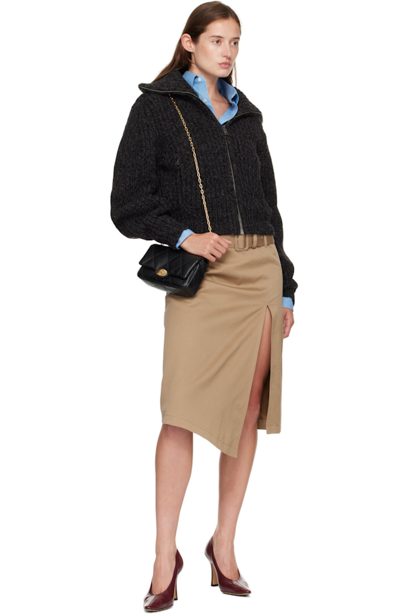 Quilted grained calfskin shoulder bag.

· Cable chain crossbody strap
· Flap with logo-embossed magnetic closure
· Four card slots at interior
· Twill lining
· H5" x W7.5" x D2.75"

Supplier color: Black