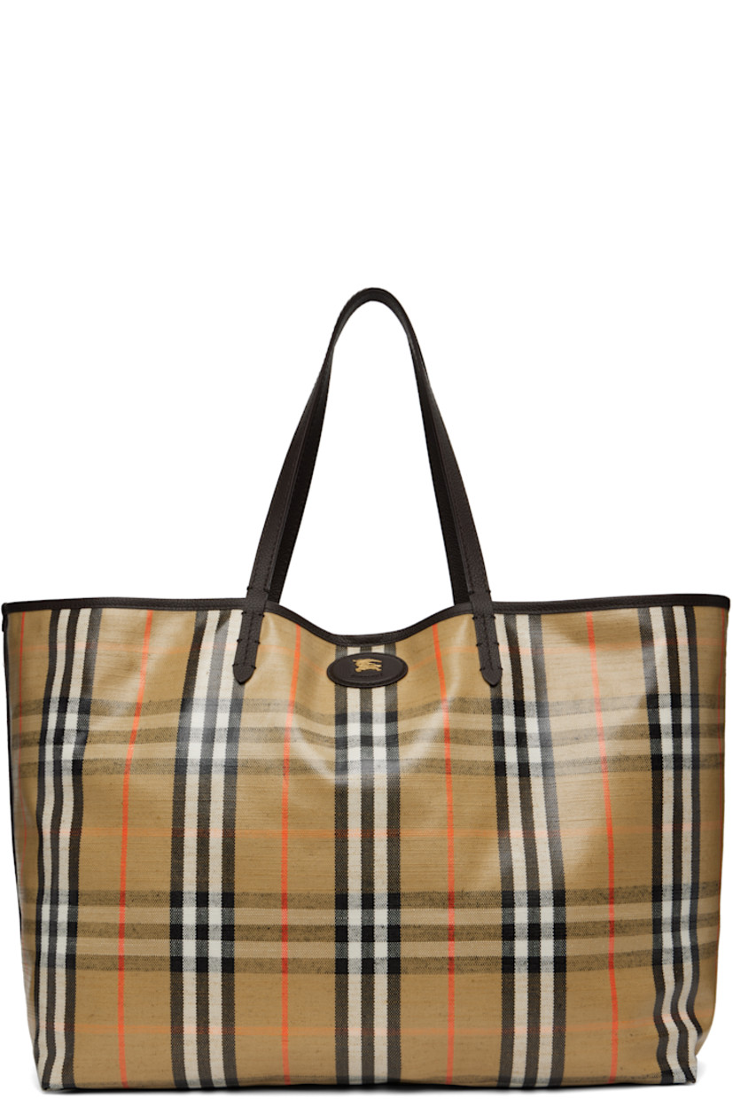 Coated canvas and pebble-grained calfskin tote. 

· Hand-painted edges
· Jacquard signature check pattern throughout 
· Fixed shoulder straps 
· Logo hardware at face
· Press-stud tab closure
· Detachable zip pouch at interior 
· Unlined
· H14" x W18" x D8.5"

Supplier color: Sand
