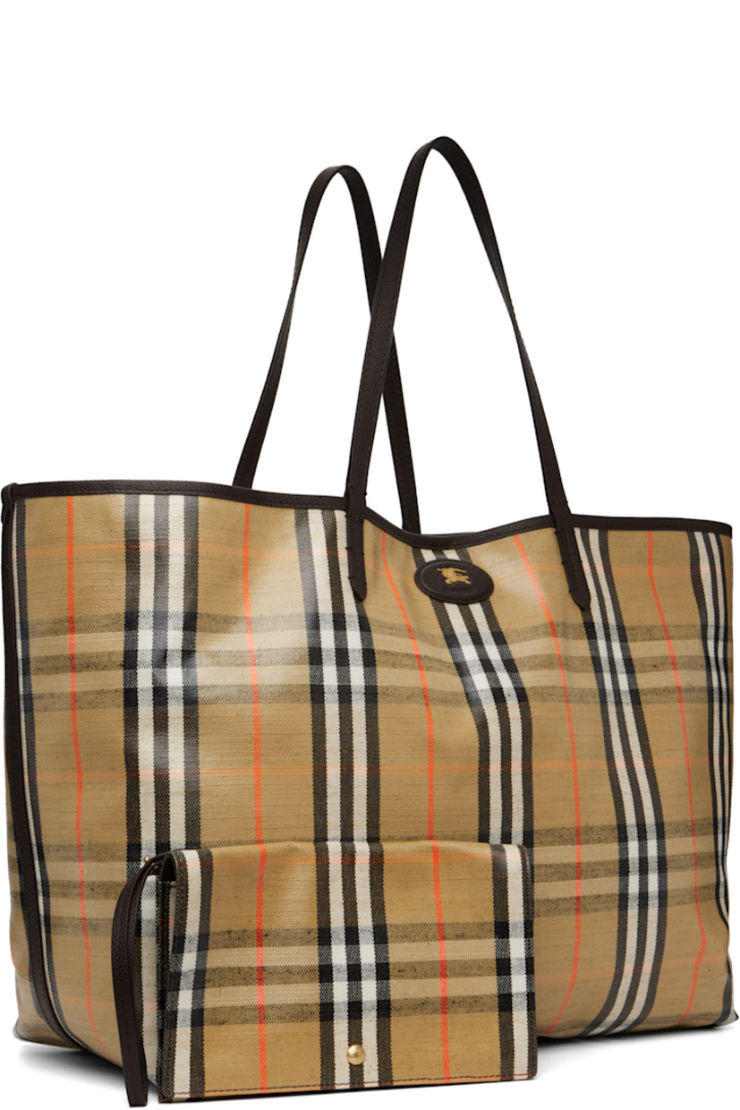 Coated canvas and pebble-grained calfskin tote. 

· Hand-painted edges
· Jacquard signature check pattern throughout 
· Fixed shoulder straps 
· Logo hardware at face
· Press-stud tab closure
· Detachable zip pouch at interior 
· Unlined
· H14" x W18" x D8.5"

Supplier color: Sand