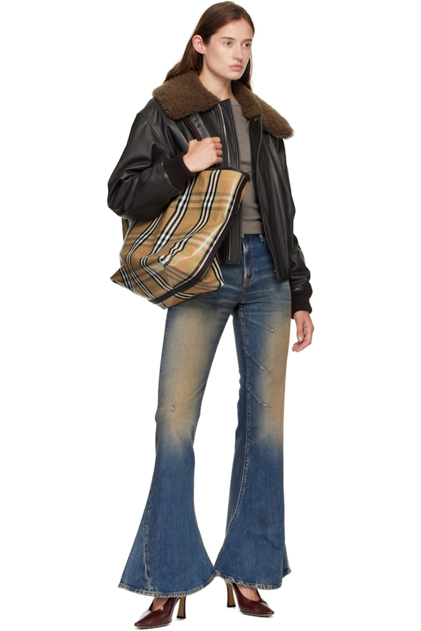 Coated canvas and pebble-grained calfskin tote. 

· Hand-painted edges
· Jacquard signature check pattern throughout 
· Fixed shoulder straps 
· Logo hardware at face
· Press-stud tab closure
· Detachable zip pouch at interior 
· Unlined
· H14" x W18" x D8.5"

Supplier color: Sand