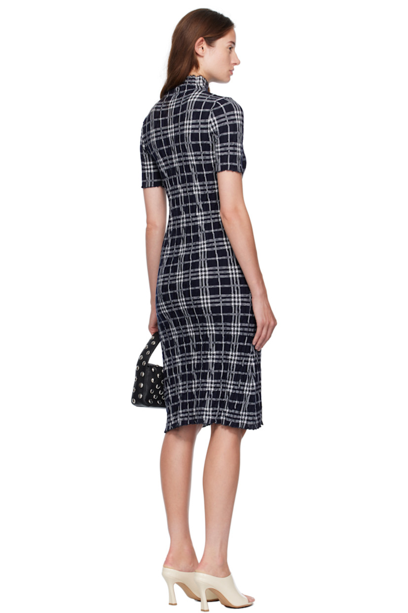 Knit wool midi dress. 

· Reverse knit pattern and jacquard check pattern
· Ruffled edge at mock neck, hem, and cuffs

Supplier color: Ink/Chalk