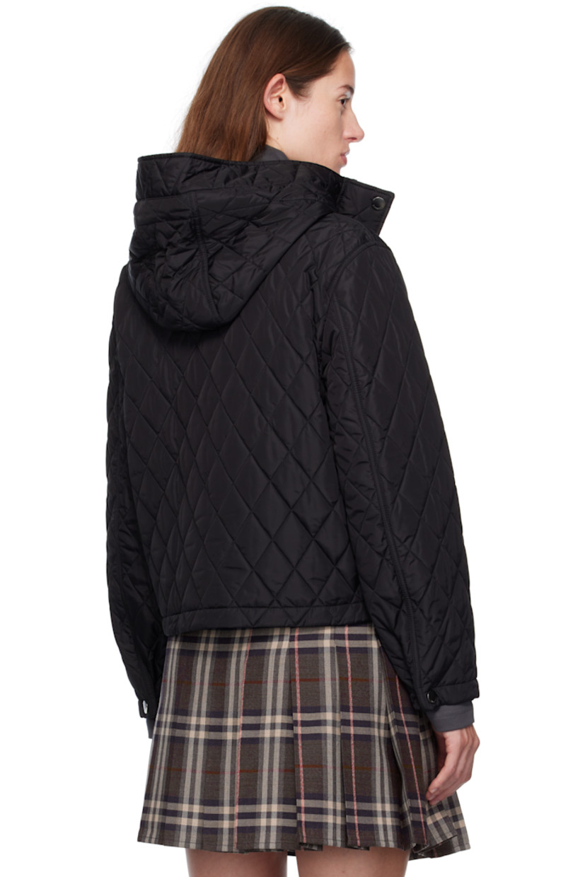 Insulated and quilted reused nylon satin jacket. 

· Cord-lock drawstring at hood
· Two-way zip closure and press-stud placket
· Flap pockets at waist
· Press-stud fastening at cuffs
· Patch pocket at interior 
· Check-patterned cotton twill lining 

Supplier color: Black