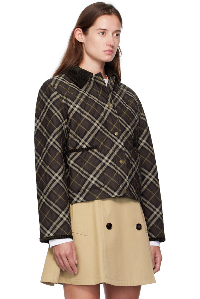 Insulated cotton canvas jacket.

· Check pattern throughout
· Corduroy trim throughout
· Spread collar
· Zip closure with press-stud placket
· Patch pockets at waist
· Cropped hem
· Logo flag at side seam
· Press-stud pocket at interior
· Quilted twill lining

Supplier color: Truffle IP check