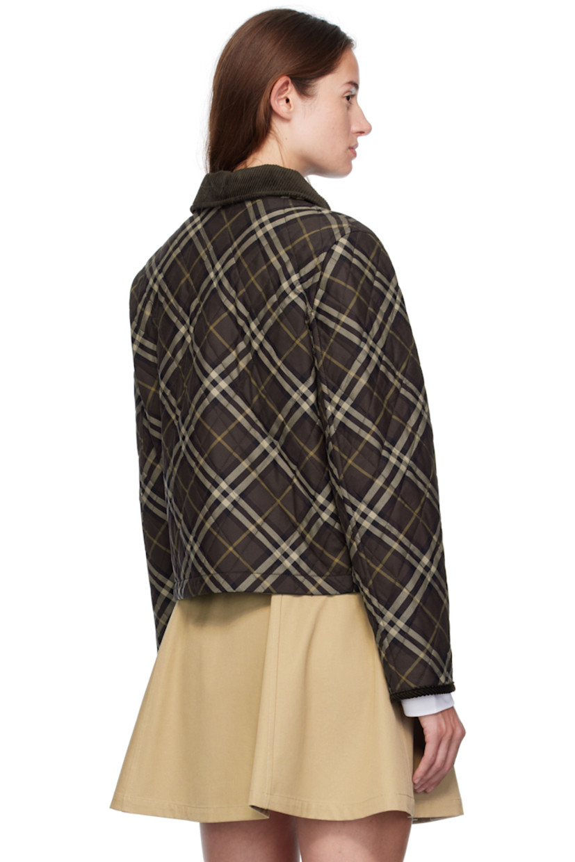 Insulated cotton canvas jacket.

· Check pattern throughout
· Corduroy trim throughout
· Spread collar
· Zip closure with press-stud placket
· Patch pockets at waist
· Cropped hem
· Logo flag at side seam
· Press-stud pocket at interior
· Quilted twill lining

Supplier color: Truffle IP check