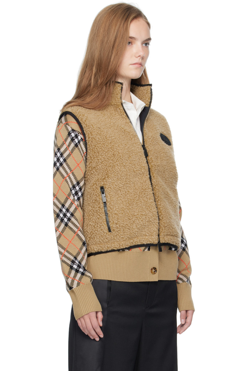 Wool-blend fleece vest.

· Stand collar
· Two-way zip closure 
· Bouclé logo patch at chest
· Zip pockets at front
· Bungee-style drawstring at cropped hem
· Full mesh lining

Supplier color: Shrew melange
