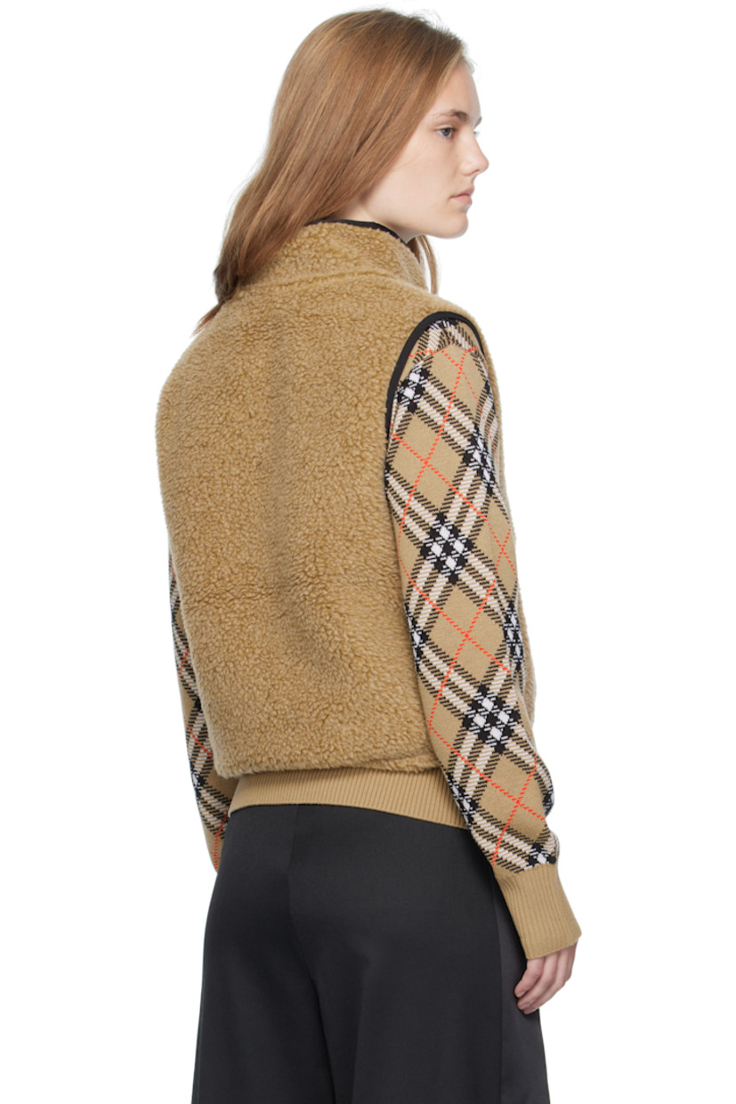 Wool-blend fleece vest.

· Stand collar
· Two-way zip closure 
· Bouclé logo patch at chest
· Zip pockets at front
· Bungee-style drawstring at cropped hem
· Full mesh lining

Supplier color: Shrew melange