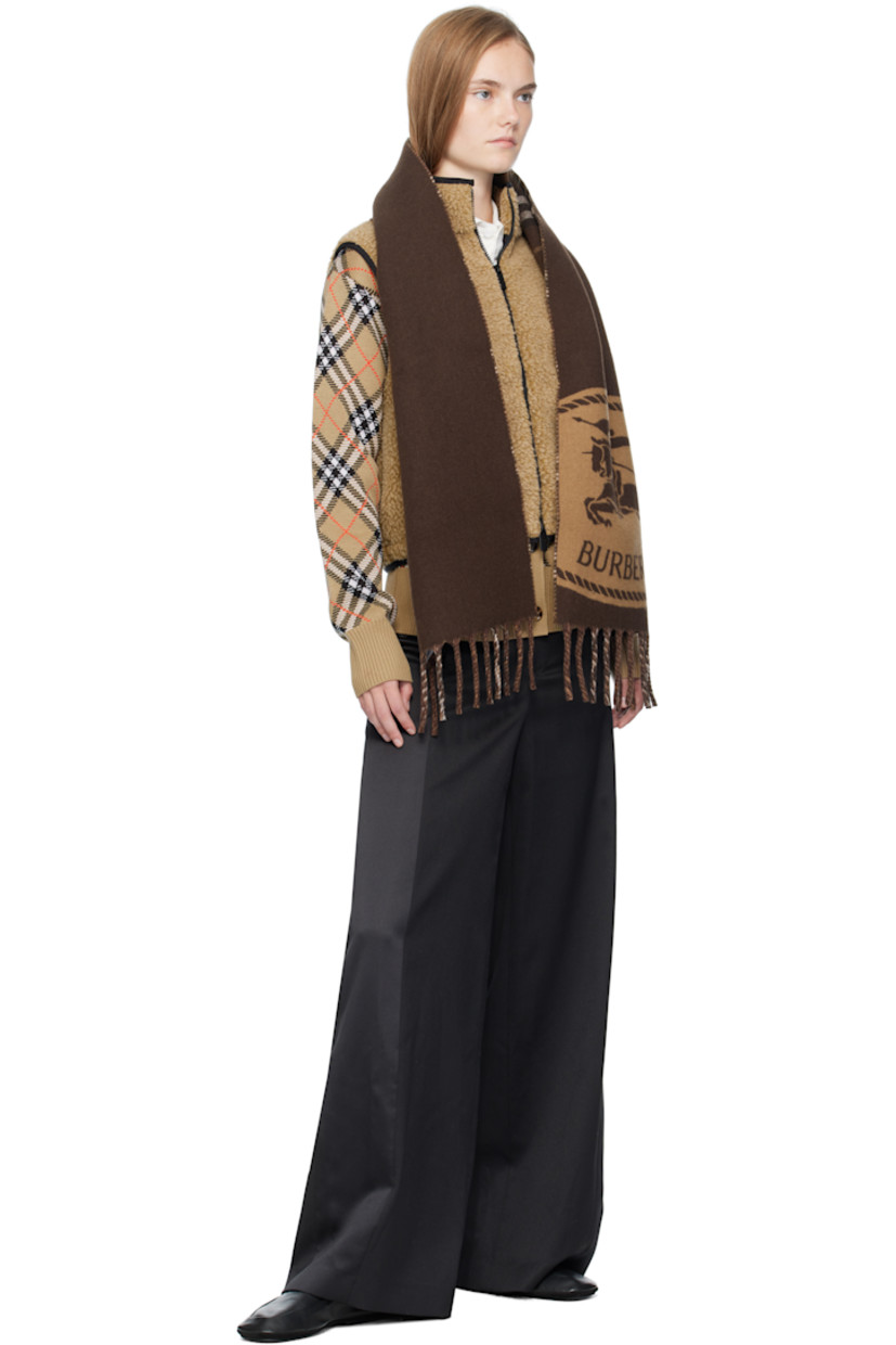 Wool-blend fleece vest.

· Stand collar
· Two-way zip closure 
· Bouclé logo patch at chest
· Zip pockets at front
· Bungee-style drawstring at cropped hem
· Full mesh lining

Supplier color: Shrew melange