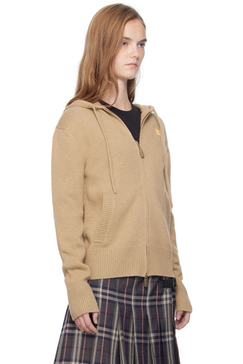 Knit wool- and cashmere-blend hoodie.

· Drawstring at hood
· Two-way zip closure
· Graphic embroidered at chest
· Welt pockets at front
· Rib-knit hem and cuffs
· Jacquard logo and graphic at back

Supplier color: Flax/Yolk