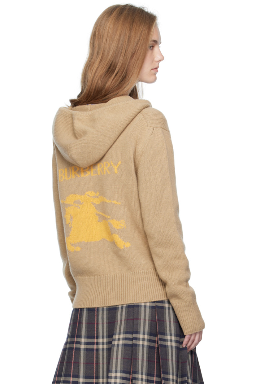 Knit wool- and cashmere-blend hoodie.

· Drawstring at hood
· Two-way zip closure
· Graphic embroidered at chest
· Welt pockets at front
· Rib-knit hem and cuffs
· Jacquard logo and graphic at back

Supplier color: Flax/Yolk