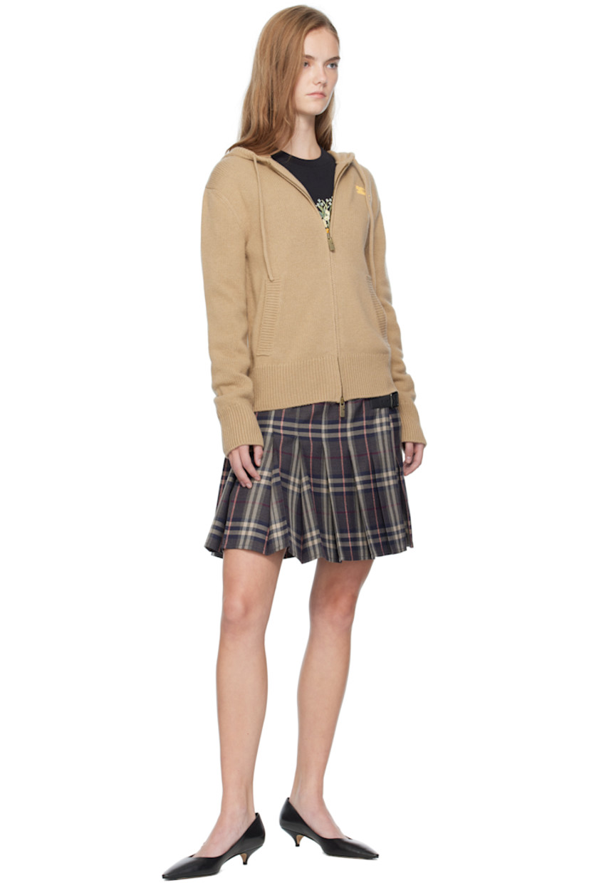 Knit wool- and cashmere-blend hoodie.

· Drawstring at hood
· Two-way zip closure
· Graphic embroidered at chest
· Welt pockets at front
· Rib-knit hem and cuffs
· Jacquard logo and graphic at back

Supplier color: Flax/Yolk