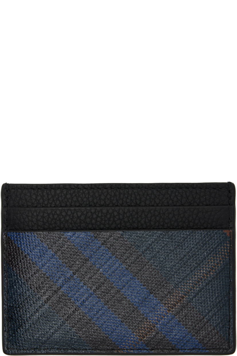 Pebble-grained calfskin and saffiano faux-leather card holder. 

· Signature check pattern throughout 
· Logo hardware at face
· Four card slots 
· Central note slot 
· Canvas lining 
· H3" x W4" 

Supplier color: Midnight