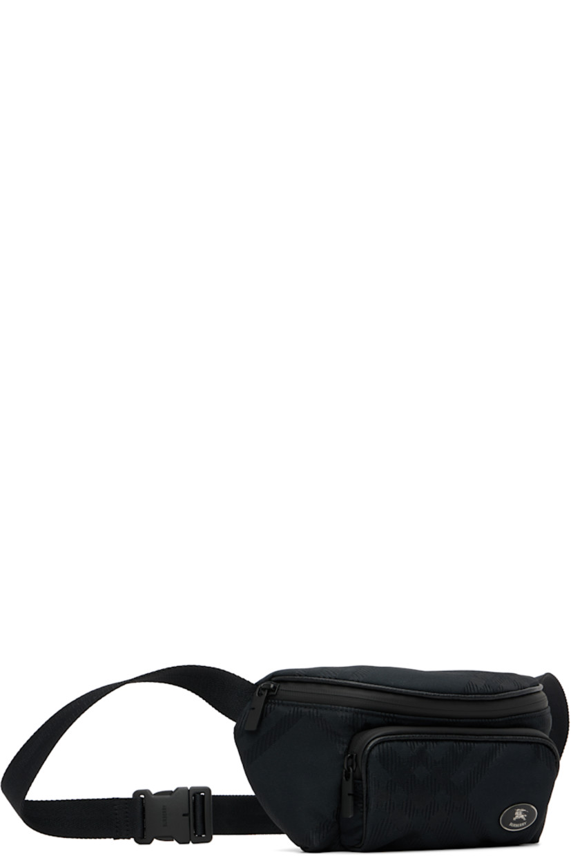 Nylon canvas belt bag. 

· Woven check pattern throughout 
· Adjustable crossbody strap
· Zip pocket with logo plaque at face
· Zip closure
· Poplin lining
· H6" x W10" x D4.5"

Supplier color: Black