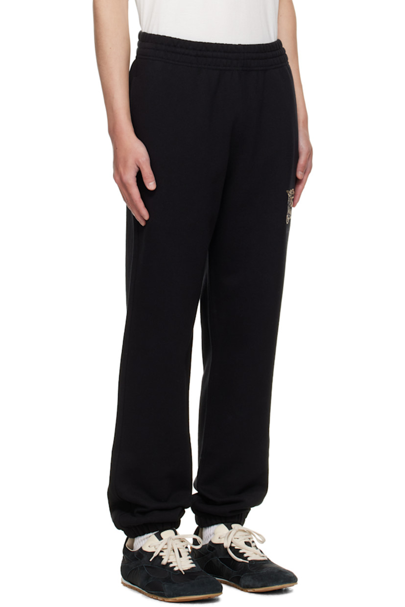 French terry sweatpants.

· Slim-fit
· Concealed drawstring at elasticized waistband
· Three-pocket styling
· Graphic patch and embroidered logo at front leg
· Elasticized cuffs

Supplier color: Black