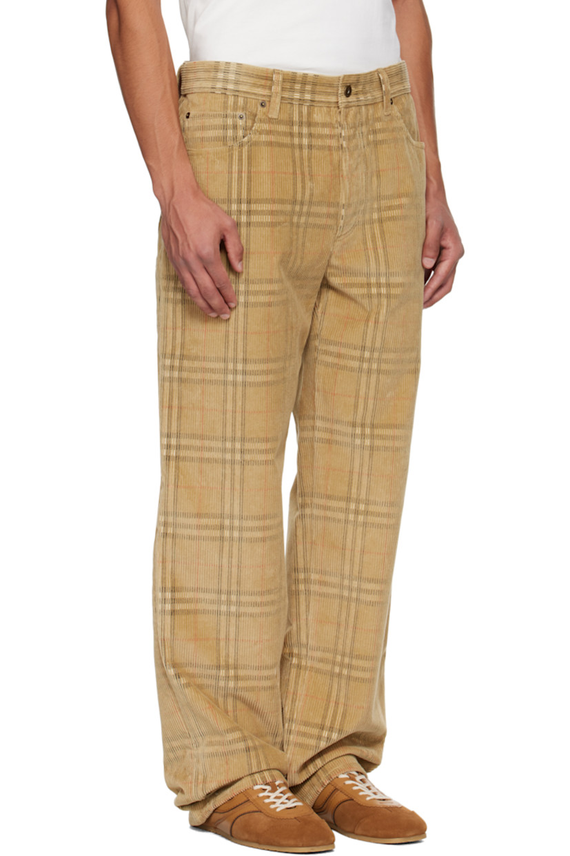 Cotton corduroy trousers. 

· Check pattern throughout 
· Loose-fit 
· Belt loops
· Five-pocket styling
· Button fly 
· Logo patch at back waistband

Supplier color: Sand IP check