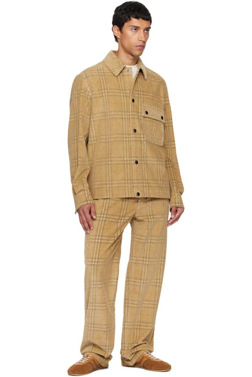 Cotton corduroy shirt. 

· Jacquard check pattern throughout 
· Spread collar 
· Press-stud closure
· Flap pocket at chest
· Pleats at buttoned barrel cuffs

Supplier color: Sand ip check
