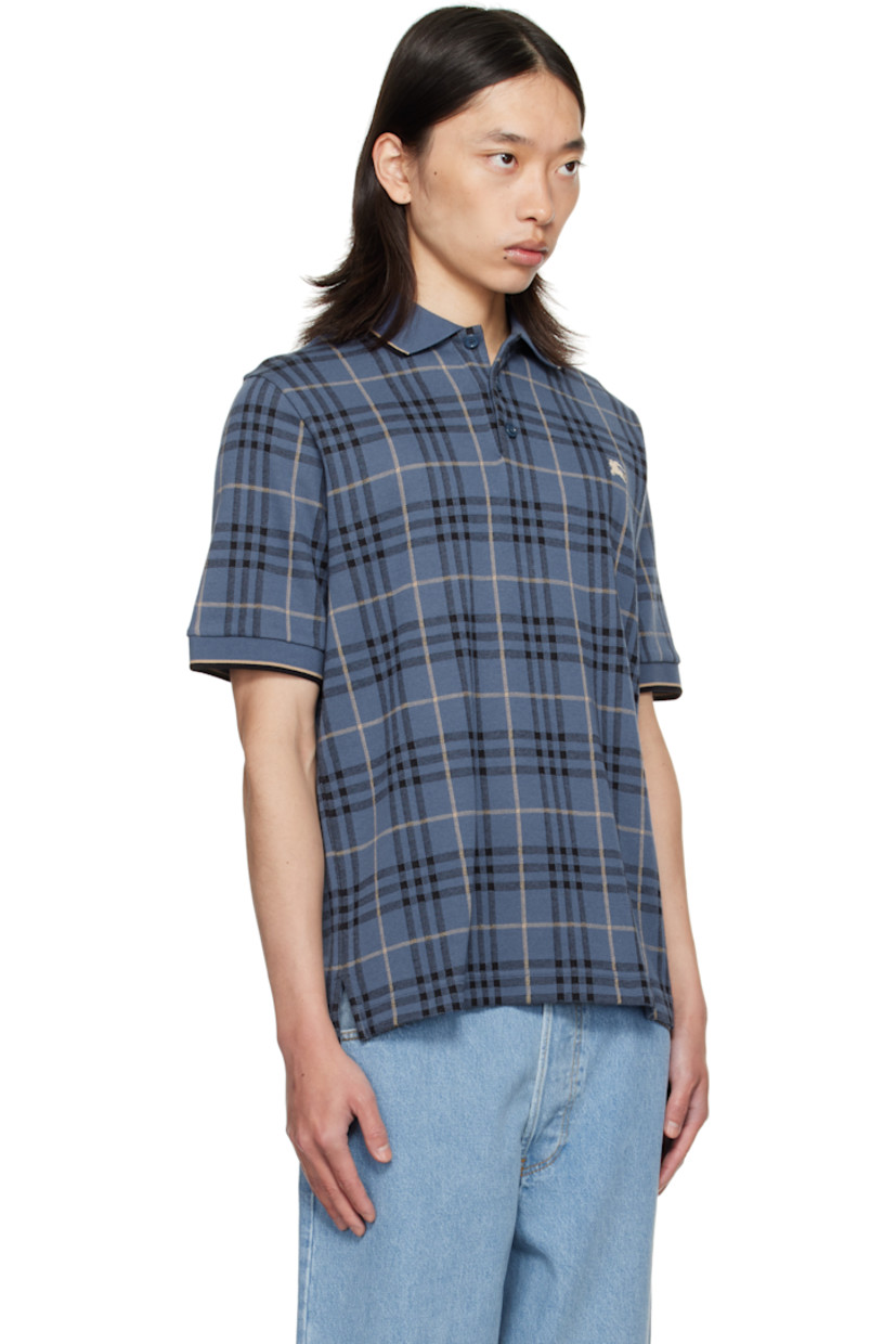 Heavyweight cotton jersey polo.

· Jacquard check pattern throughout
· Striped rib-knit spread collar and cuffs
· Button placket
· Embroidered logo at chest
· Vented side seams

Supplier color: Bay blue