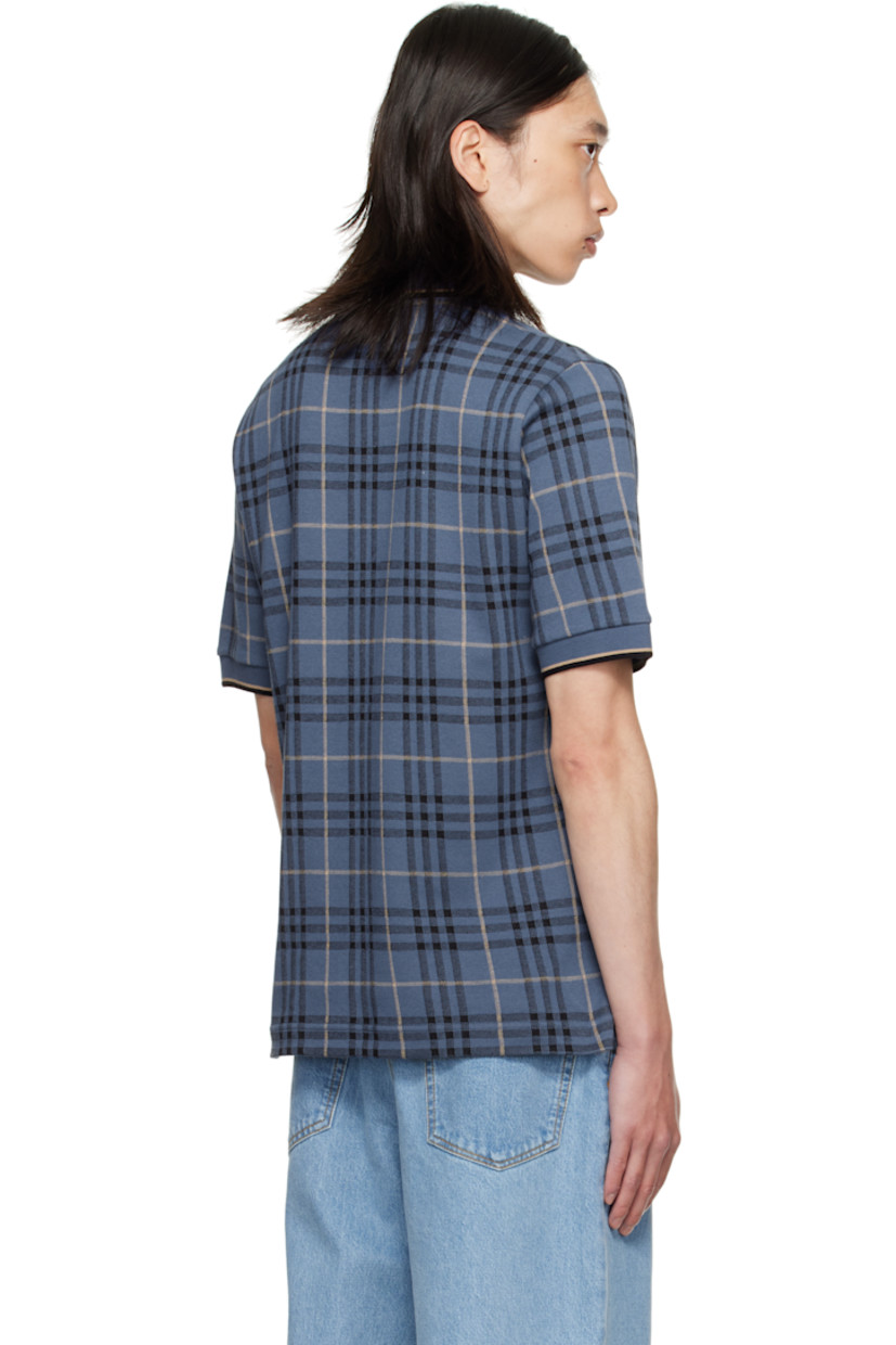 Heavyweight cotton jersey polo.

· Jacquard check pattern throughout
· Striped rib-knit spread collar and cuffs
· Button placket
· Embroidered logo at chest
· Vented side seams

Supplier color: Bay blue