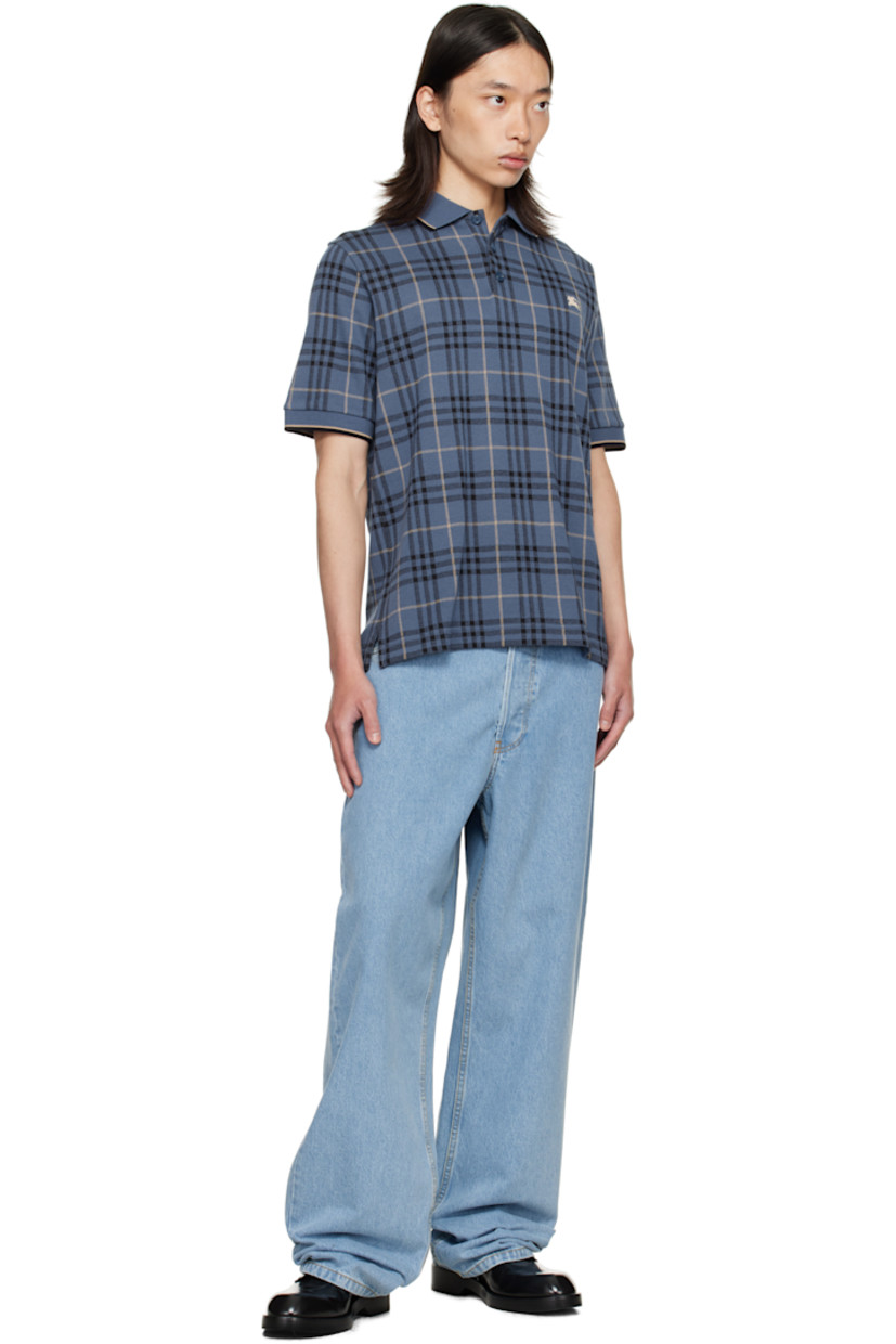 Heavyweight cotton jersey polo.

· Jacquard check pattern throughout
· Striped rib-knit spread collar and cuffs
· Button placket
· Embroidered logo at chest
· Vented side seams

Supplier color: Bay blue