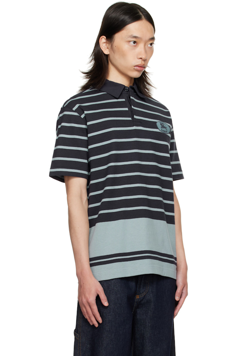 Heavyweight cotton jersey polo.

· Intarsia stripes throughout
· Poplin spread collar
· Concealed button placket
· Embroidered logo patch at chest
· Vented side seams

Supplier color: IP Stripe