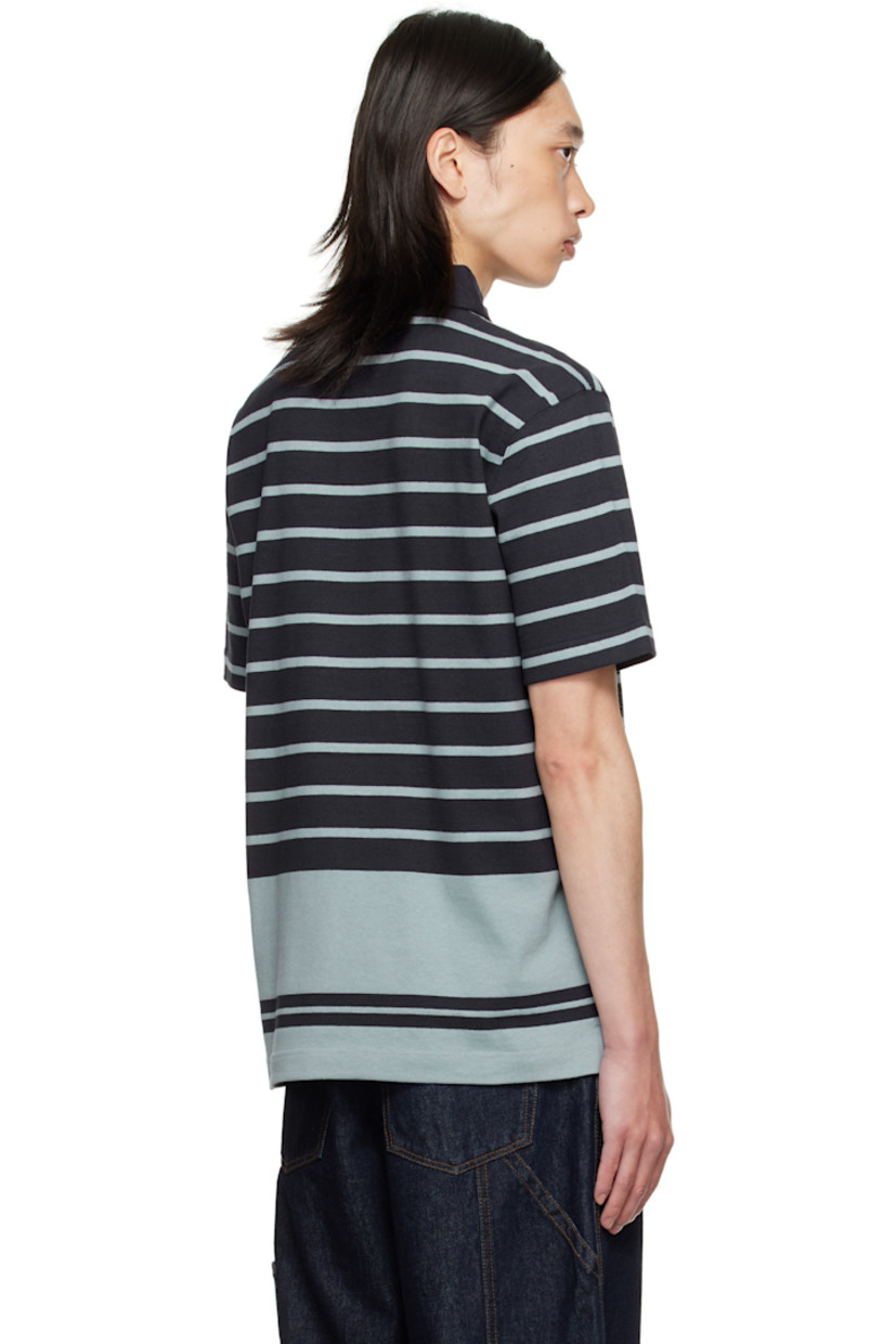 Heavyweight cotton jersey polo.

· Intarsia stripes throughout
· Poplin spread collar
· Concealed button placket
· Embroidered logo patch at chest
· Vented side seams

Supplier color: IP Stripe