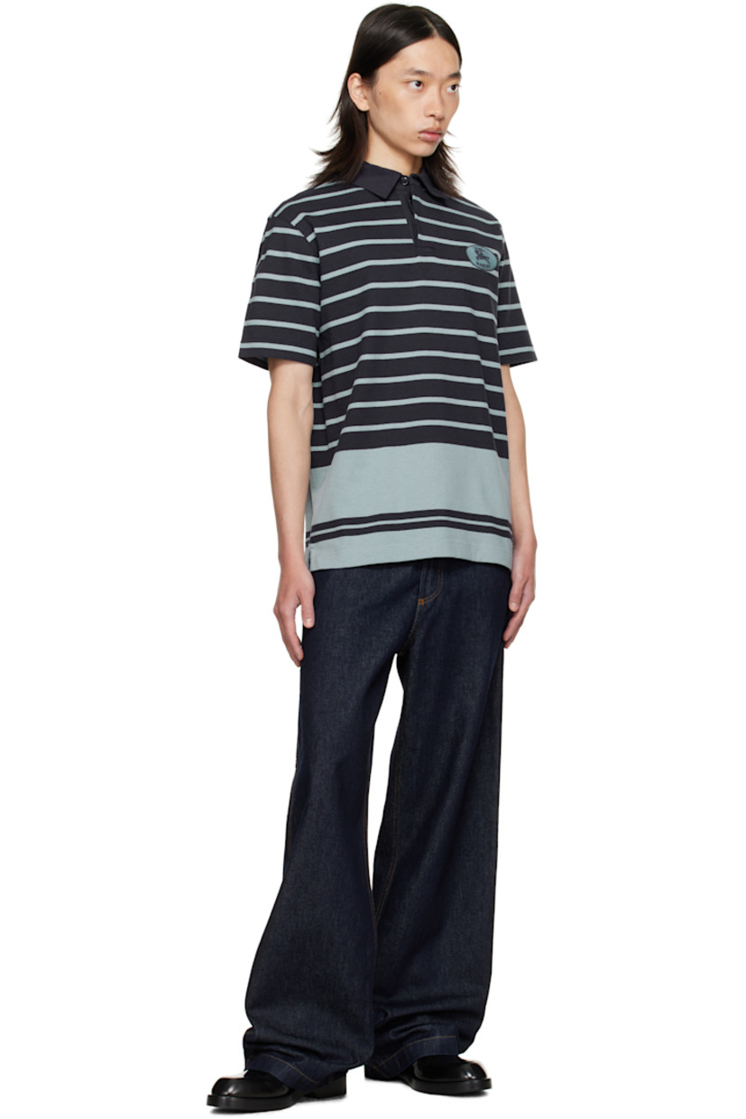 Heavyweight cotton jersey polo.

· Intarsia stripes throughout
· Poplin spread collar
· Concealed button placket
· Embroidered logo patch at chest
· Vented side seams

Supplier color: IP Stripe