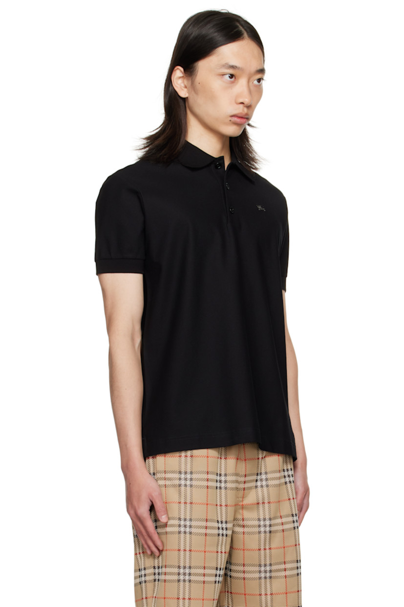 Cotton piqué polo.

· Rib-knit spread collar and cuffs
· Three-button placket
· Logo hardware at chest
· Tennis-tail hem

Supplier color: Black