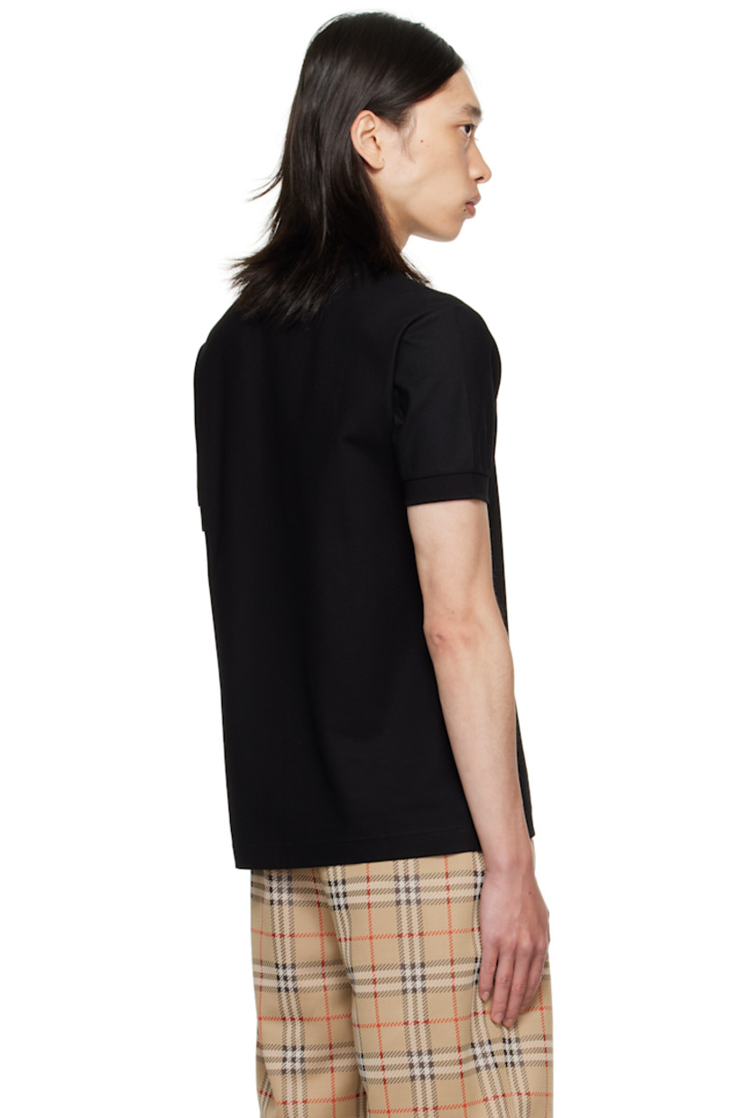 Cotton piqué polo.

· Rib-knit spread collar and cuffs
· Three-button placket
· Logo hardware at chest
· Tennis-tail hem

Supplier color: Black