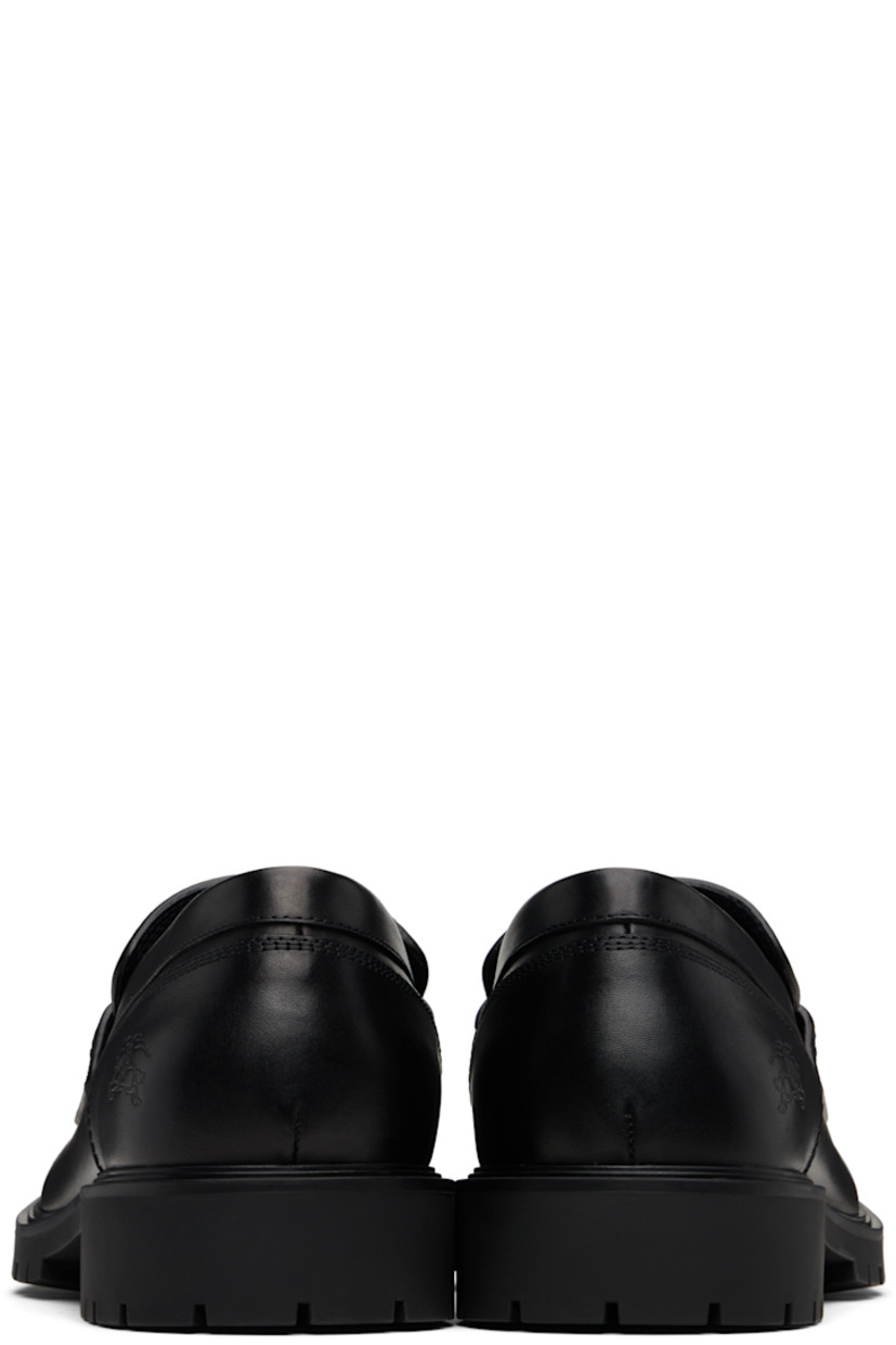 Buffed calfskin loafers.

· Moc toe 
· Strap with cutout and inset logo hardware at vamp
· Logo embossed at outer side
· Treaded rubber sole 

Supplier color: Black