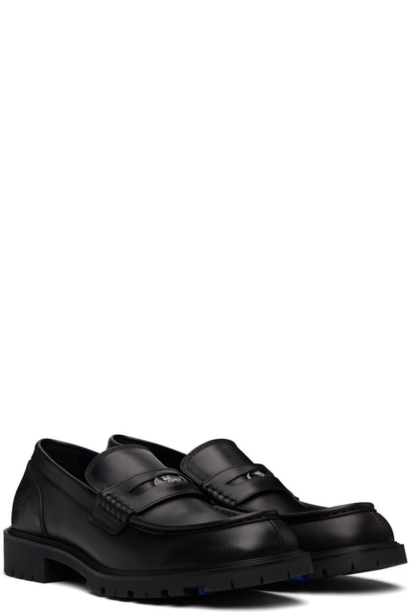 Buffed calfskin loafers.

· Moc toe 
· Strap with cutout and inset logo hardware at vamp
· Logo embossed at outer side
· Treaded rubber sole 

Supplier color: Black