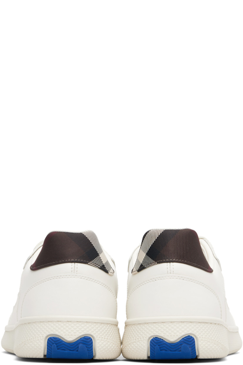 Low-top buffed calfskin and twill sneakers.

· Signature check pattern throughout 
· Lace-up closure
· Logo patch at padded tongue 
· Padded collar 
· Textured rubber midsole 
· Treaded rubber sole

Supplier color: Cotton/Mahogany ip check
