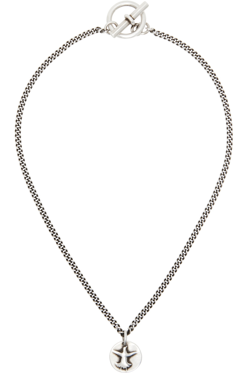 Handcrafted curb chain necklace in sterling silver. 

· Graphic pendant at drop
�· Toggle fastening 
· L17.5"

Supplier color: Antique silver