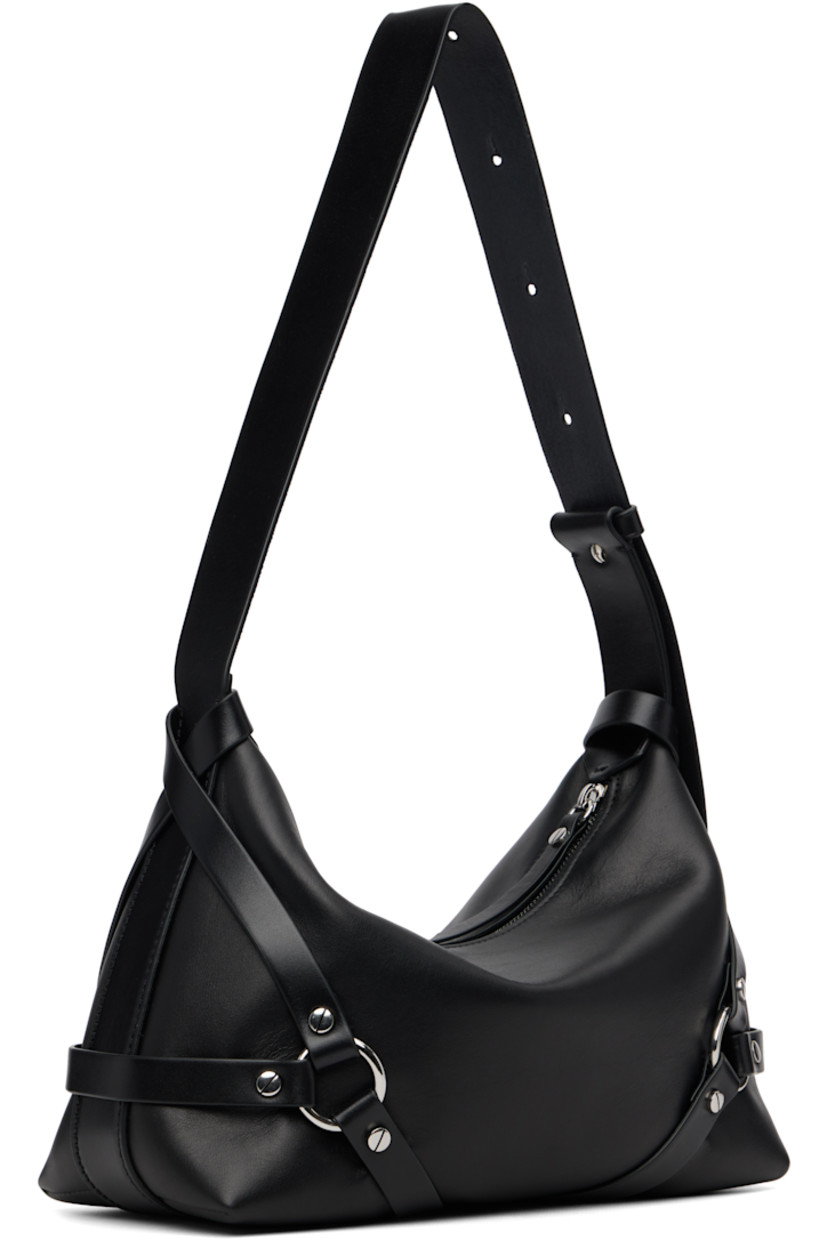 Buffed calfskin shoulder bag.

· Adjustable shoulder strap
· Logo embossed at face
· Harness-style strap at sides
· Zip closure
· Patch pocket at interior
· Twill lining
· H7" x W12" x D5"

Supplier color: Black