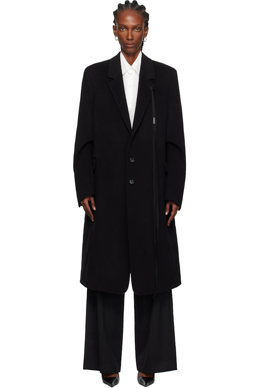 Virgin wool- and cashmere-blend melton coat. 

· Notched lapel
· Detachable grosgrain ribbon with logo plaque at lapel
· Button closure
· Flap pockets at waist
· Padded shoulders
· Central vent at back hem
· Welt pockets at interior
· Plain-woven cotton lining

Supplier color: Black